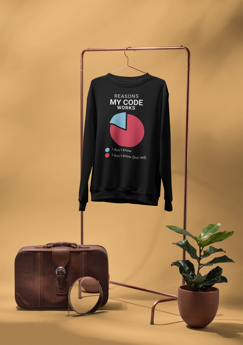 May include: Black sweatshirt with a white graphic of a pie chart and the text "Reasons My Code Works". The pie chart is divided into two sections, one blue and one red. The blue section is labelled "I don't know" and the red section is labelled "I don't know (but red)".