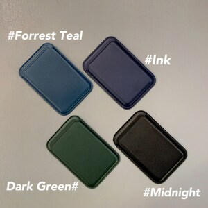 May include: Four leather card holders in different colors: Forrest Teal, Ink, Dark Green, and Midnight. Each card holder has a stitched edge.