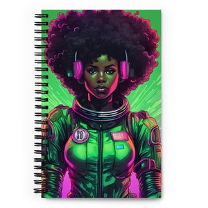 May include: A woman with an afro wearing headphones and a green spacesuit with a pink and blue patch. The background is a green and pink gradient.