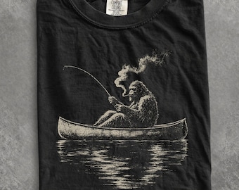 Comfort Colors Bigfoot Fishing Shirt, Vintage Sasquatch Canoe Tee, Funny Cryptid Shirt, Outdoors Fishing Graphic Tee, Bigfoot Lover Gift