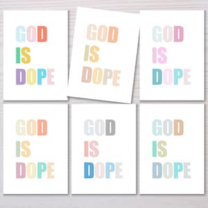 May include: Six printable cards with the phrase "GOD IS DOPE" in different pastel colors. Each card has a different color scheme for the text.
