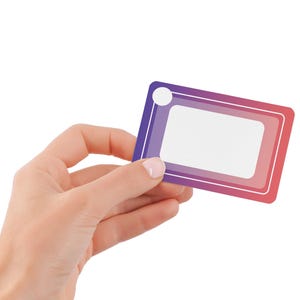 May include: A rectangular card with a white center, framed by a gradient of purple to red. A white circle is in the upper left corner. The card is held against a white background.