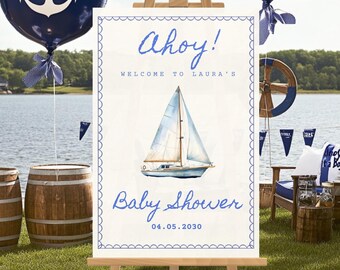 Könnte beinhalten: Ein Schild mit der Aufschrift "Ahoy! Willkommen zu Lauras Baby Shower" mit einer Illustration eines blauen und weißen Segelboots. Das Schild steht auf einem Staffelei mit blauen und weißen Ankerballons im Hintergrund.