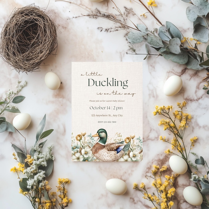 May include: A baby shower invitation with a duckling illustration and floral accents. The invitation reads "a little Duckling is on the way" and includes the date and time of the shower.