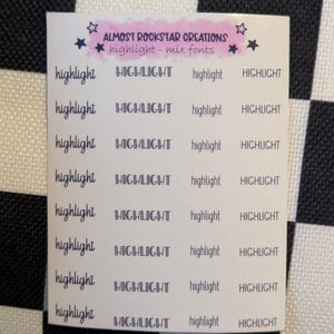 May include: A sheet of stickers with the words "highlight" and "HIGHLIGHT" in various fonts. The stickers are arranged in rows and columns. The text "ALMOST ROCKSTAR CREATIONS highlight - mix fonts" is at the top of the sheet.