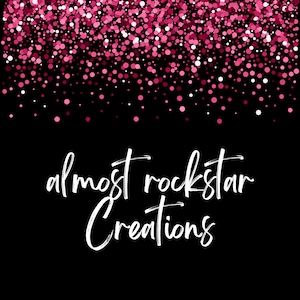 May include: A black background with pink glitter and the text "almost rockstar Creations" in white script. The glitter consists of pink and white dots, creating a festive and eye-catching design.