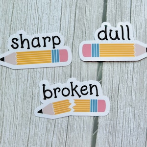 May include: Three pencil stickers with different states of sharpness. The first sticker says "sharp" and shows a yellow pencil with a pink eraser. The second sticker says "dull" and shows a yellow pencil with a pink eraser. The third sticker says "broken" and shows a yellow pencil with a pink eraser that is broken in half.