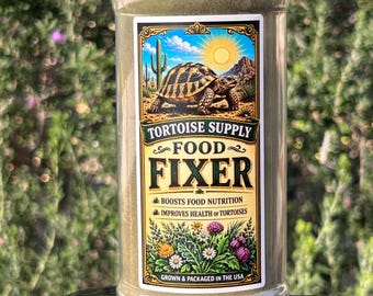 May include: A clear plastic jar of tortoise food, with a black lid. The label features a desert scene with a tortoise, cactus, and sun. Text on the label reads "Tortoise Supply Food Fixer" and "Boosts Food Nutrition, Improves Health of Tortoises."