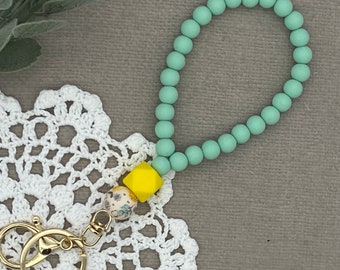 Llavero de pulsera con cuentas de silicona y forma de lazo hexagonal de Lemonade