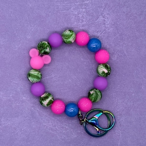 Llavero de pulsera con cuentas inspirado en Pandora que brilla en la oscuridad