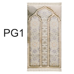 May include: A beige prayer mat with a geometric mosaic design in shades of beige, grey, and purple. The mat features an arched window-like pattern and a fringed edge. The text "PG1" is in the upper left corner.