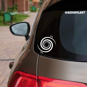 May include: A white vinyl decal of a spiral with three small dots on a dark brown car. The decal is on the back window of the car. The text "@ASVINYLART" is on the top right corner of the image.