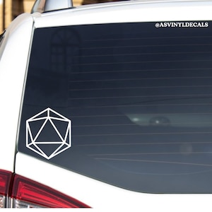 May include: White vinyl decal of a 20-sided die, also known as a d20, on a car window. The decal is a popular symbol for tabletop role-playing games.