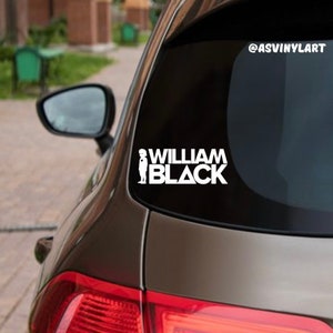 May include: White vinyl decal with the text "William Black" and a silhouette of a person in a suit. The decal is on the back window of a car. The social media handle "@asvinylart" is in the upper right corner of the image.