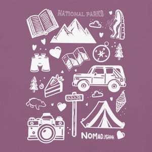 May include: White line art illustrations of outdoor adventure elements on a purple background. Includes mountains, a map, a compass, a car, a tent, a camera, and the text "NATIONAL PARKS" and "NOMAD.ISHHH".