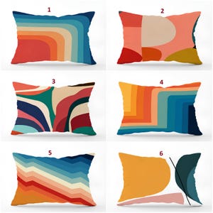 May include: Six rectangular throw pillows featuring various graphic patterns. Pillow 1 has blue and orange curves. Pillow 2 has red, pink, and yellow shapes. Pillow 3 has abstract multi-colored waves. Pillow 4 has blue and orange zigzags. Pillow 5 has blue and orange chevrons. Pillow 6 has yellow and blue shapes with a black line.