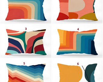May include: Six rectangular throw pillows featuring various graphic patterns. Pillow 1 has blue and orange curves. Pillow 2 has red, pink, and yellow shapes. Pillow 3 has abstract multi-colored waves. Pillow 4 has blue and orange zigzags. Pillow 5 has blue and orange chevrons. Pillow 6 has yellow and blue shapes with a black line.