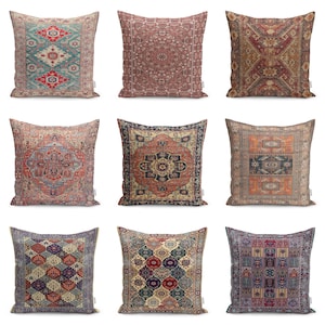 May include: Nine decorative throw pillows with intricate, vintage-style rug patterns. The pillows feature a variety of colors, including teal, red, brown, and orange, with geometric and floral designs. The pillows are square-shaped and appear to be made of a soft fabric.