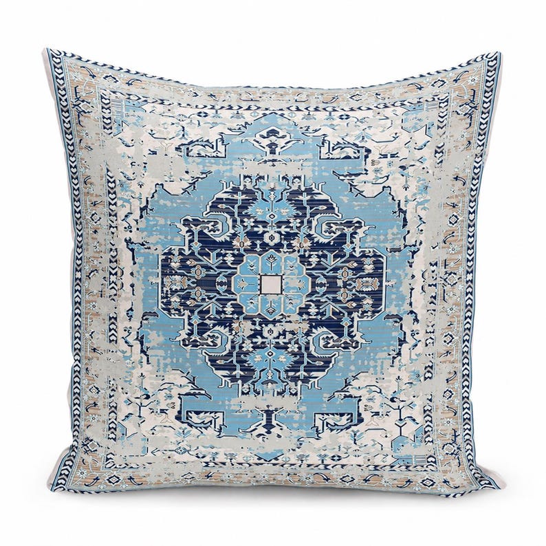 May include: A square throw pillow featuring a central medallion pattern in shades of navy blue, light blue, and cream. The design includes intricate geometric and floral motifs with a distressed texture and a decorative border.
