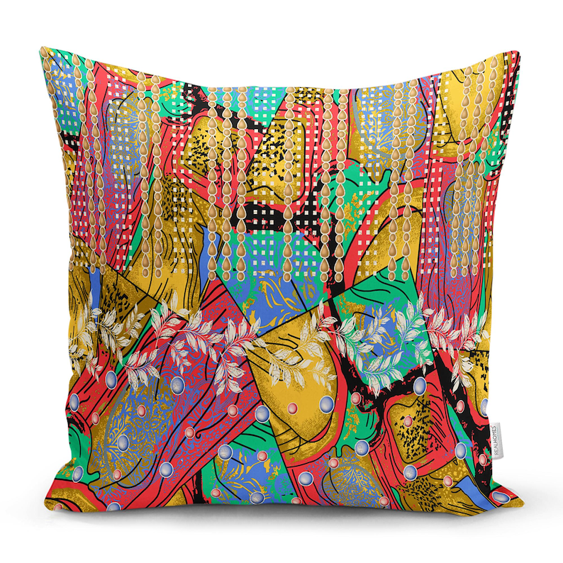 May include: A colourful throw pillow with a geometric pattern featuring gold chains, red, blue, green, and yellow colours. The pillow has a unique and modern design.