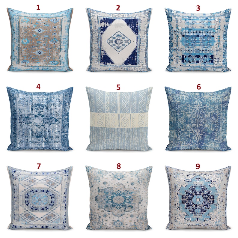 May include: A collection of nine square throw pillows featuring various blue, white, and beige patterns. Each pillow displays distinct geometric, floral, or distressed designs, numbered one through nine, arranged in a three-by-three grid layout.