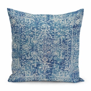 May include: A square throw pillow featuring a deep blue and off-white intricate medallion pattern. The design displays a symmetrical, detailed geometric motif with a distressed, faded appearance across the entire fabric surface.
