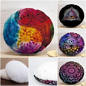 May include: A collection of round throw pillows featuring vibrant, multi-colored mandala and eye-themed graphic prints. The designs include a yin-yang style pattern, a triangle-enclosed eye, and intricate floral mandalas. Some pillows are plain white.