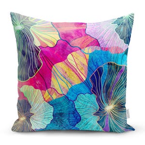 May include: A colourful throw pillow featuring a floral pattern in shades of pink, blue, yellow, and purple. The design incorporates abstract flowers with intricate lines and watercolour effects.
