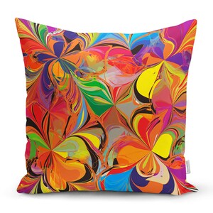 May include: A colourful throw pillow with a swirling abstract pattern in shades of red, orange, yellow, green, blue, and purple.