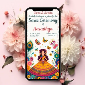 May include: A digital invitation for a Saree Ceremony for Aaradhya. The invitation features a colourful illustration of a girl in a traditional Indian saree, surrounded by flowers and butterflies. The text on the invitation reads "Vamsi & Swetha Cordially Invite you to join us for the Saree Ceremony of Aaradhya 11 AM, 18 June Sunday 2024 Delphin clubhouse, Fairview, IX"