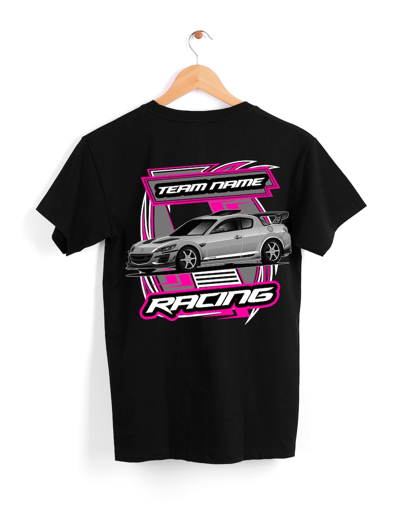 May include: Black t-shirt with a pink and gray graphic of a silver car with the text "TEAM NAME" and "RACING" on it.