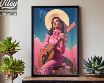 May include: A framed print of a woman in a pink dress playing a guitar. The background is a blue sky with clouds and a full moon. The print is titled "Wiley & Co. Mercantile".