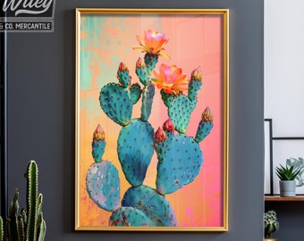 May include: A framed print of a cactus with pink flowers against a peach and orange background. The cactus is green and has a prickly texture.