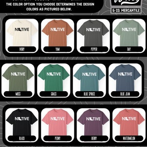 May include: A selection of Comfort Colors 1717 T-shirts in various colors, each featuring the word "NATIVE" with a state outline. Colors include ivory, yam, pepper, bay, moss, grass, blue spruce, blue jean, black, peony, berry, and watermelon. The Wiley & Co. Mercantile logo is in the upper right.