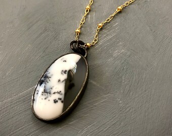 Gorgeous Dendritic Opal, oxidized silver bezel on a 14k gold filled chain with bead detail, oval shape pendant looks like a snowy landscape.