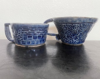 Pair of hand-carved blue ceramic mugs