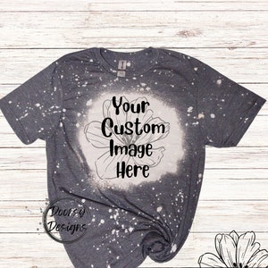 May include: A gray t-shirt with white bleach splatters and a floral design. The text "Your Custom Image Here" is printed on the shirt.