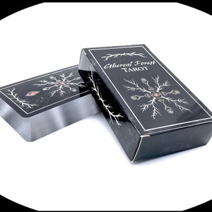 Ethereal Forest Tarot box and cards featuring silver gilded edges.