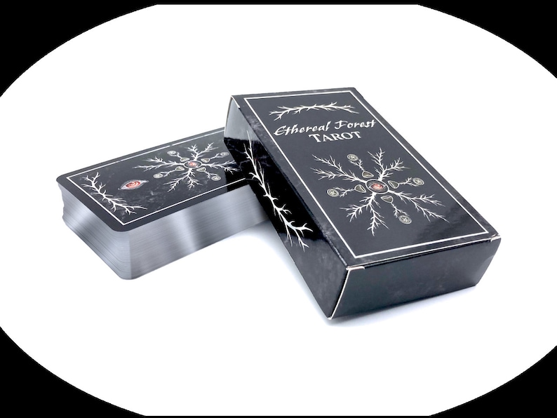 Ethereal Forest Tarot box and cards featuring silver gilded edges.