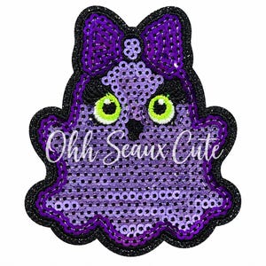 May include: A purple sequin patch shaped like a ghost with a bow on its head. The ghost has bright green eyes with black pupils and long eyelashes. The text Ohh Seaux Cute is written in white script across the center of the purple sequin body.
