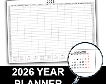 May include: A white 2026 year planner with monthly calendars and daily planning sections. The word "2026" is at the top, with the months listed across the top. A magnifying glass highlights the November calendar.