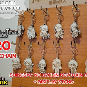 Pacote com 20 chaveiros + suporte de exposição do anime Attack on Titan. Arquivos cortados a laser .svg/lbrn/cdr/dxf/rld/pdf/ai. Chaveiros + suporte de exposição.