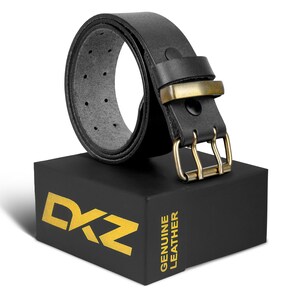 May include: A black leather belt with a brass buckle and double prong. The belt is rolled up and sitting on a black box with the text "DZ GENUINE LEATHER" printed in gold.