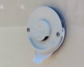 May include: White plastic Truma hot water heater outlet with a lever handle. The outlet is labelled "HOT".