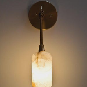 Elegant Alabaster & Brass Wall Sconce Mid-Century Modern Light Ambient Glow for Luxury Interiors