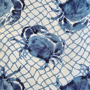 May include: Blue crabs are repeated on a white background with a blue fishing net pattern. The crabs are painted in a watercolor style.