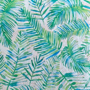 May include: A white background with a repeating pattern of green and blue palm leaves.