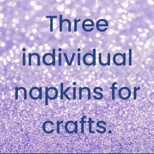 May include: Three individual napkins for crafts. The text is displayed in dark blue font against a bright, out-of-focus, sparkling light purple background that creates a bokeh effect across the entire image surface.