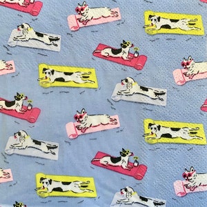 May include: A light blue patterned background featuring cartoon dogs wearing sunglasses and sunbathing on yoga mats. The dogs are black and white with pink, yellow, and white mats. A small plant is next to some of the dogs.