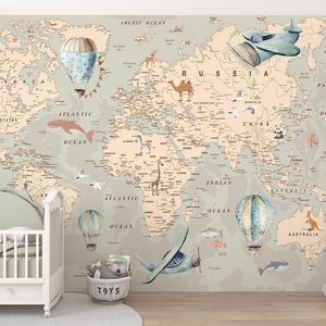 May include: A child's nursery with a world map mural depicting hot air balloons, aeroplanes, and animal illustrations. A white cot and a stuffed elephant are in the foreground. The map is in muted tones of beige, green, and blue.